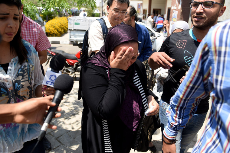 Media reporters surround relatives of those on the missing plane on May 19, 2016 in Cairo, Egypt. (Photo by Zhao Dingzhe/Xinhua/Zuma)