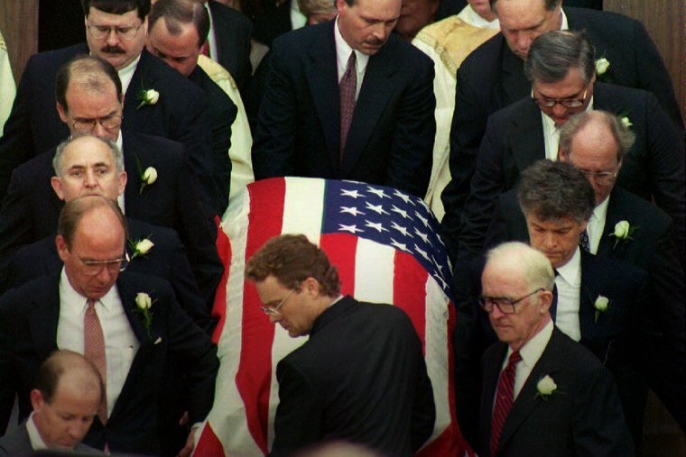 Pallbearers remove the casket of deputy White House counsel Vince Foster Jr. after funeral services at St. Andrews Catholic Cathedral in Little Rock, Ark., July 23, 1993. (Photo by Bob Ochen/AFP/Getty)