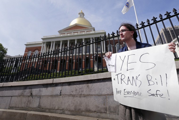 Asa Goodwillie, of Watertown, Mass., who is transgender, protests outside the Statehouse in Boston, June 1, 2016. (Photo by Charles Krupa/AP)