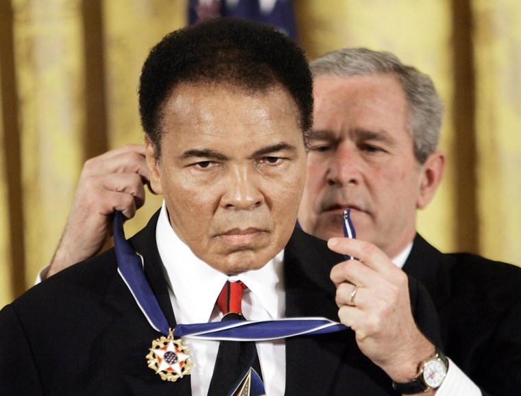 President Bush presents the Presidential Medal of Freedom to boxer Muhammad Ali in the East Room of the White House on Nov. 9, 2005. (Photo by Evan Vucci/AP)