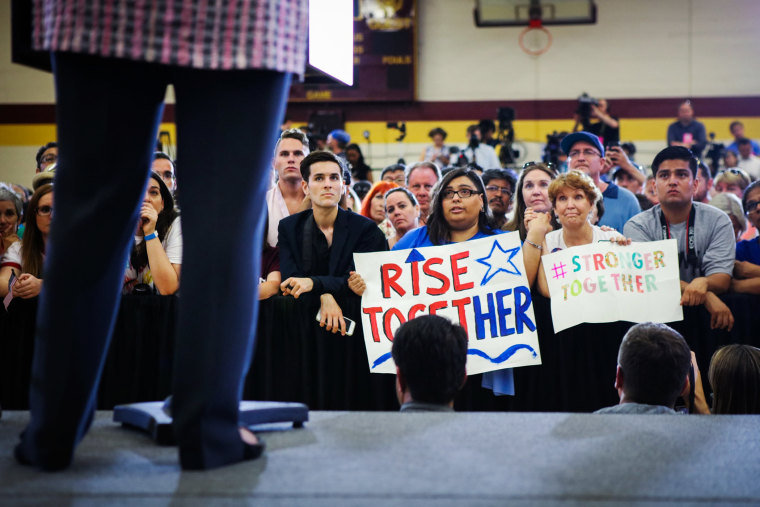 Supporters listen as Democratic presidential candidate Hillary Clinton speaks during a campaign rally at Sacramento City College on June 5, 2016 in Sacramento, Calif. (Photo by Gabrielle Lurie/AFP/Getty)
