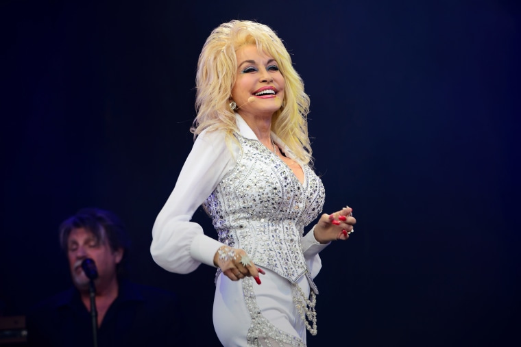 In this June 29, 2014 file photo, singer Dolly Parton performs at Glastonbury music festival, in England. (Photo by Jonathan Short/Invision/AP)