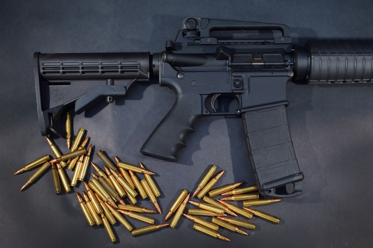 In this photo illustration, an AR-15 rifle is seen with ammunition on Dec. 18, 2012 in Miami, Fla. (Photo by Joe Raedle/Getty)