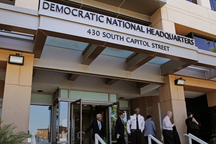 People stand outside the Democratic National Committee (DNC) headquarters in Washington, Tuesday, June 14, 2016. (Photo by Paul Holston/AP)