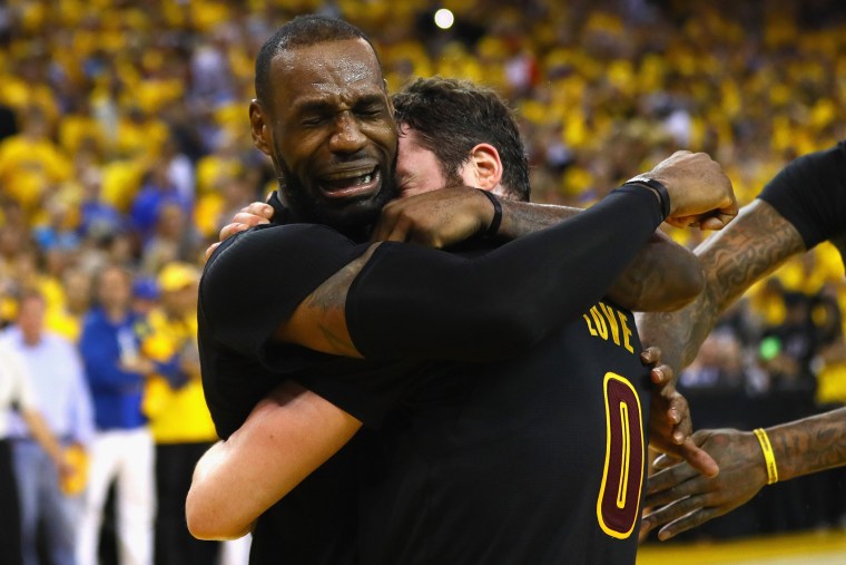LeBron James #23 and Kevin Love #0 of the Cleveland Cavaliers celebrate after defeating the Golden State Warriors 93-89 in Game 7 of the 2016 NBA Finals at ORACLE Arena on June 19, 2016 in Oakland, Calif. (Photo by Ezra Shaw/Getty)