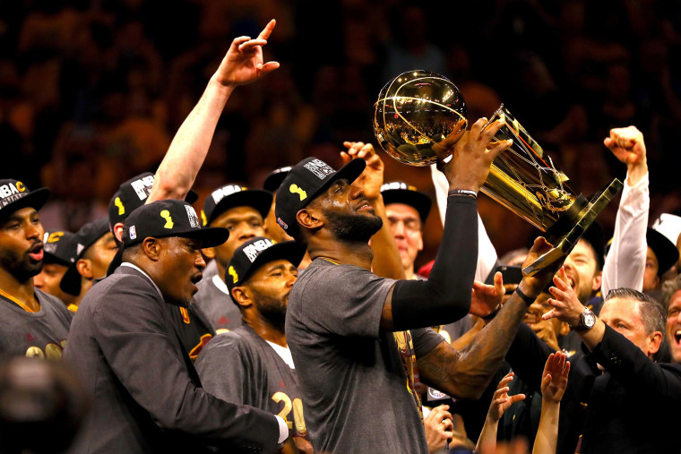 LeBron James #23 of the Cleveland Cavaliers holds the Larry O'Brien Championship Trophy after defeating the Golden State Warriors 93-89 in Game 7 of the 2016 NBA Finals at ORACLE Arena on June 19, 2016 in Oakland, Calif. (Photo by Ezra Shaw/Getty)