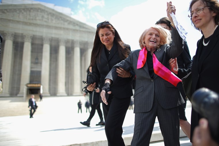 Edith Windsor acknowledges her supporters as she leaves the Supreme Court March 27, 2013 in Washington, DC. (Photo by Chip Somodevilla/Getty)