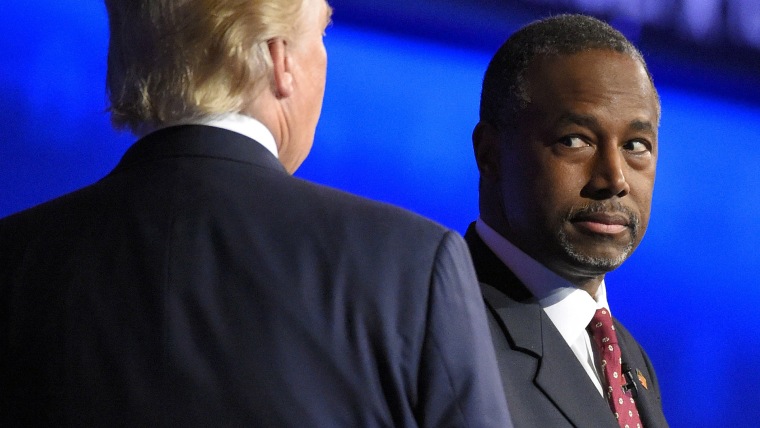 Ben Carson watches as Donald Trump takes the stage during the CNBC Republican presidential debate at the University of Colorado, Oct. 28, 2015, in Boulder, Colo. (Photo by Mark J. Terrill/AP)