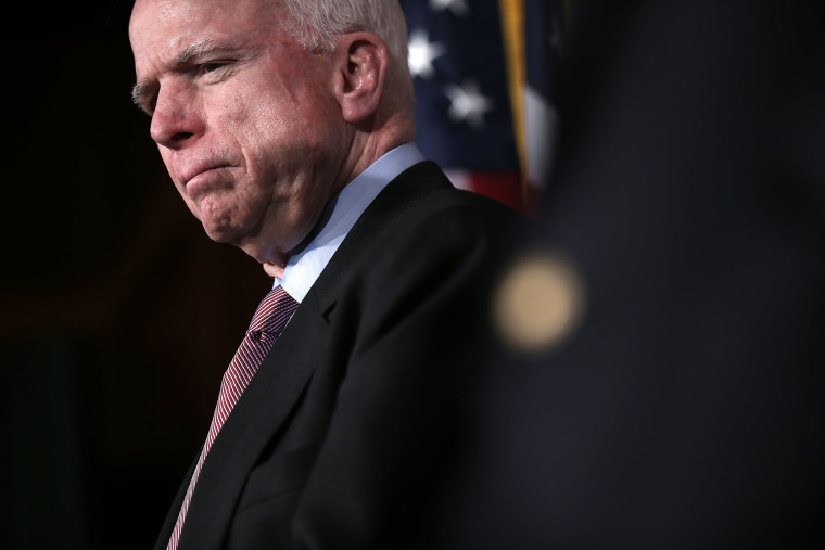 U.S. Senator John McCain (R-AZ) listens during a news conference on the terror attack that killed four Americans in Benghazi Feb. 14, 2013 on Capitol Hill in Washington, DC. (Photo by Alex Wong/Getty)