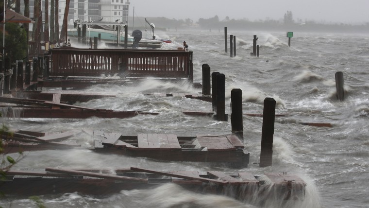 Heavy waves caused by Hurricane Matthew pound the boat docks at the Sunset Bar and Grill, Oct. 7, 2016 on Cocoa Beach, Fla. (Photo by Mark Wilson/Getty)