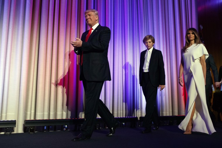 President-elect Donald Trump, arrives with his son Barron, center, and wife Melania, to speak to an election night rally, Nov. 9, 2016, in N.Y. (Photo by Evan Vucci/AP)