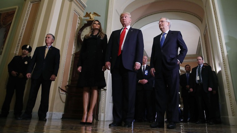 President-elect Donald Trump, walks with his wife Melania Trump, and Senate Majority Leader Mitch McConnell after a meeting at the U.S. Capitol Nov. 10, 2016 in Washington, DC. (Photo by Mark Wilson/Getty)