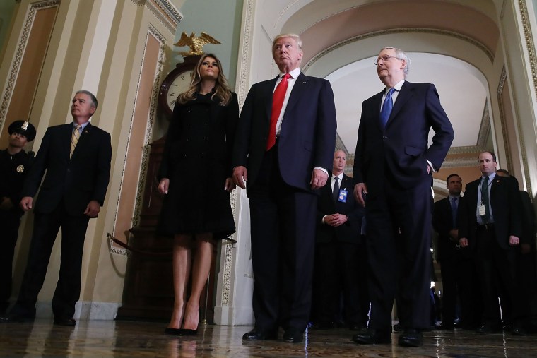 President-elect Donald Trump,  walks with his wife Melania Trump, and Senate Majority Leader Mitch McConnell after a meeting at the U.S. Capitol Nov. 10, 2016 in Washington, DC. (Photo by Mark Wilson/Getty)