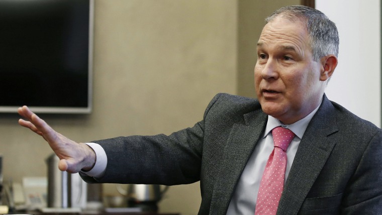 In this March 10, 2016 photo, Scott Pruitt, Oklahoma Attorney General, gestures as he speaks during an interview in Oklahoma City, Okla. (Photo by Sue Ogrocki/AP)