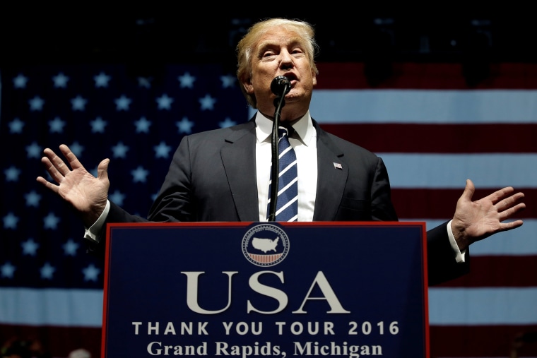 Image: U.S. President-elect Donald Trump speaks at a \"Thank You USA\" tour rally in Grand Rapids