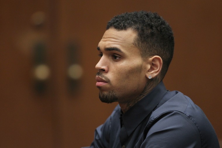 R&B singer Chris Brown appears in court for a probation progress hearing on Feb. 3, 2014 in Los Angeles, Calif. (Photo by David McNew/Getty)