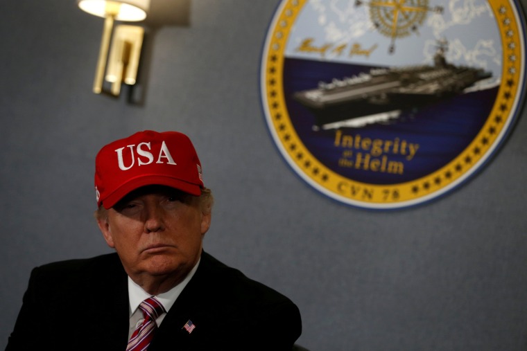 Image: FILE PHOTO - Donald Trump gets a briefing before he tours the pre-commissioned U.S. Navy aircraft carrier Gerald R. Ford in Newport News Virginia