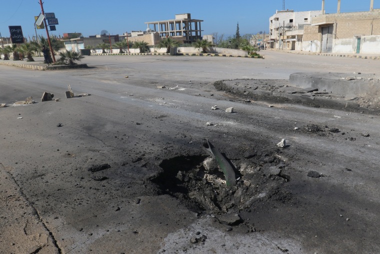 Image: A crater is seen at the site of an airstrike, after what rescue workers described as a suspected gas attack in the town of Khan Sheikhoun in rebel-held Idlib