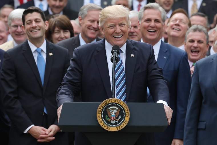 Image: U.S. President Trump celebrates with Republican House members after healthcare bill vote at the White House in Washington