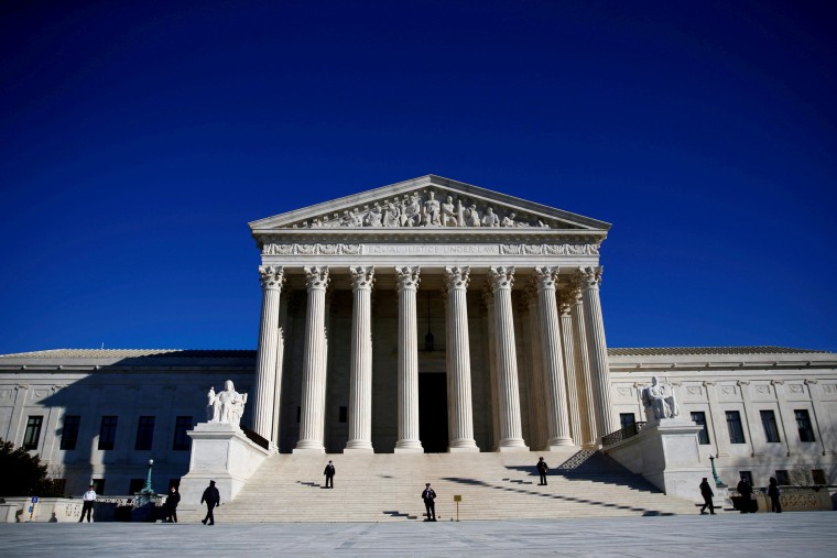 Image: FILE PHOTO: Police officers stand in front of the U.S. Supreme Court in Washington