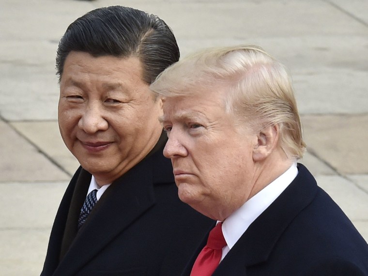 File photo taken in November 2017 shows U.S. President Donald Trump (and Chinese President Xi Jinping attending a welcome ceremony in Beijing.