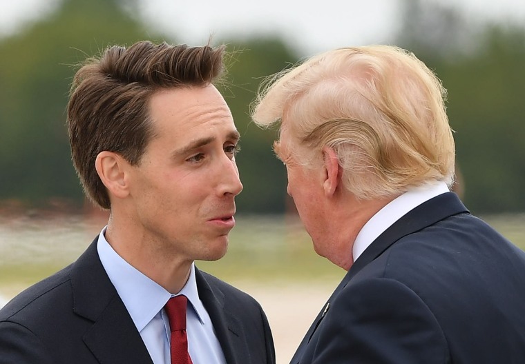 US President Donald Trump is greeted by US senatorial candidate Attorney General Josh Hawley upon arrival at Springfield-Branson National Airport in Springfield, Missouri on September 21, 2018.