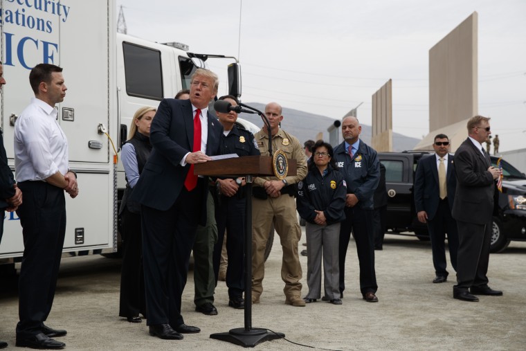President Donald Trump talks with reporters after reviewing border wall prototypes, Tuesday, March 13, 2018, in San Diego.