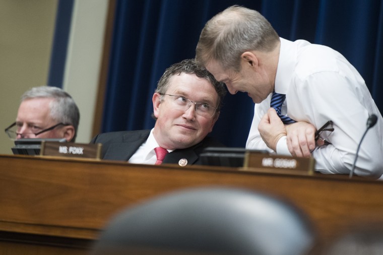 Reps. Thomas Massie, R-Ky., center, Jim Jordan, R-Ohio, right, are seen during a House Oversight and Reform Committee hearing on Tuesday, April 9, 2019.