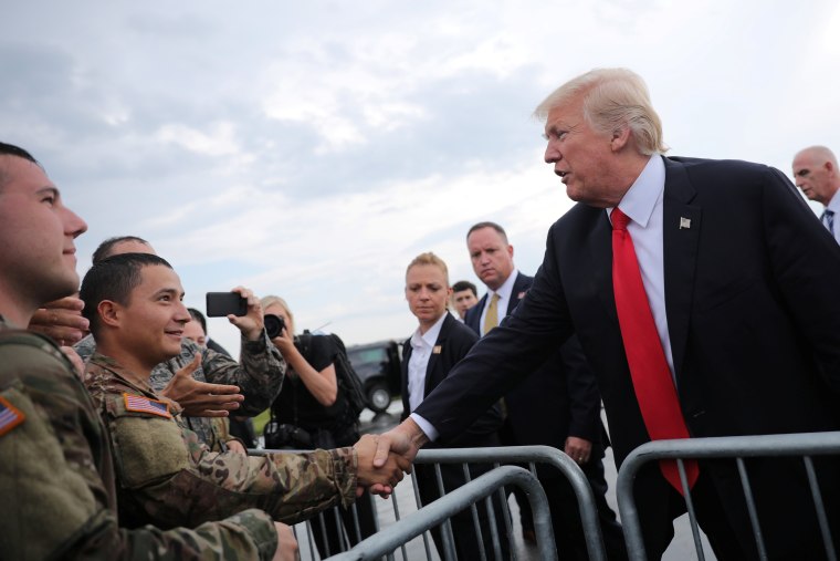 U.S. President Donald Trump greets members of the military as he arrives at Raleigh County Memorial Airport in Beaver, West Virginia, U.S., July 24, 2017.