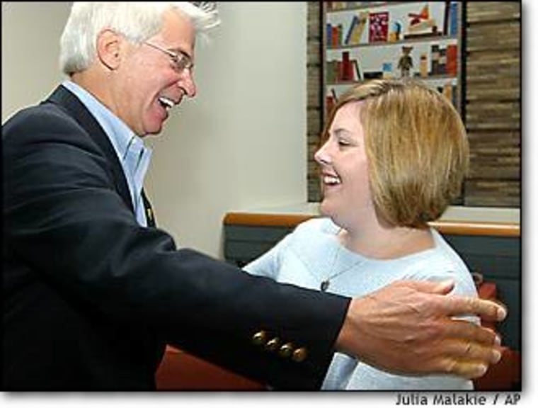 Elizabeth Jordan Carr, America's first 'test-tube' baby, now 21, embraces Dr. Fred Wirth, her birth delivery doctor, Tuesday during a reunion in Boston.