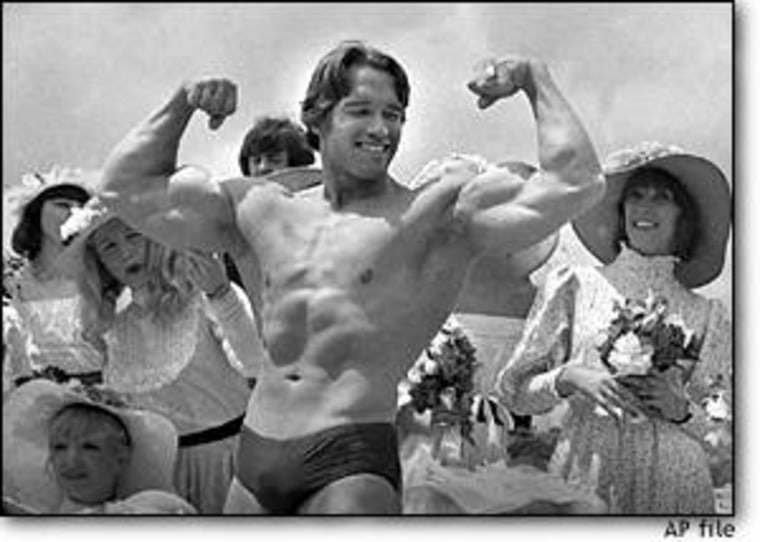 Arnold Schwarzenegger shows off his body for an appreciative audience on May 20, 1977, in Cannes, France, where his documentary film 'Pumping Iron' was being presented at the Cannes Film Festival.