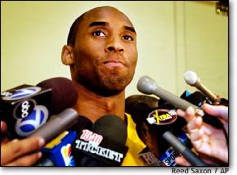Los Angeles Lakers' Kobe Bryant faces dozens of reporters and photographers at Los Angeles Lakers media day on Friday. Bryant refused to talk about his sexual assault case.