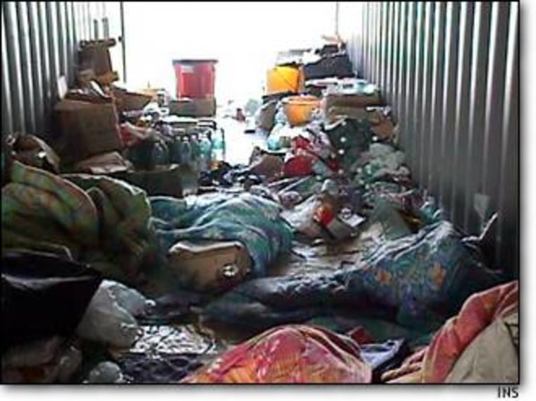 Litter and bedding covers the floor of the hard-top container used to smuggle 15 Chinese nationals to the United States.