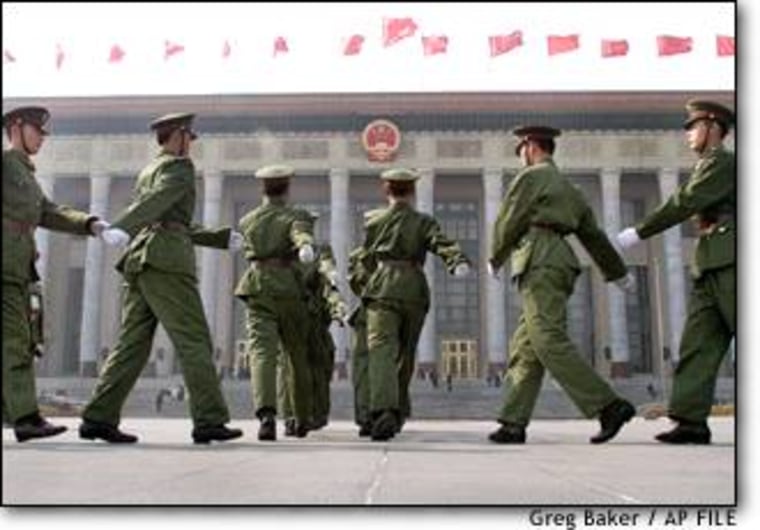 Soldiers march towards Beijing's Great Hall of the People in Beijing during the closing ceremony of the annual Chinese People's Political Consultative Conference March 12.