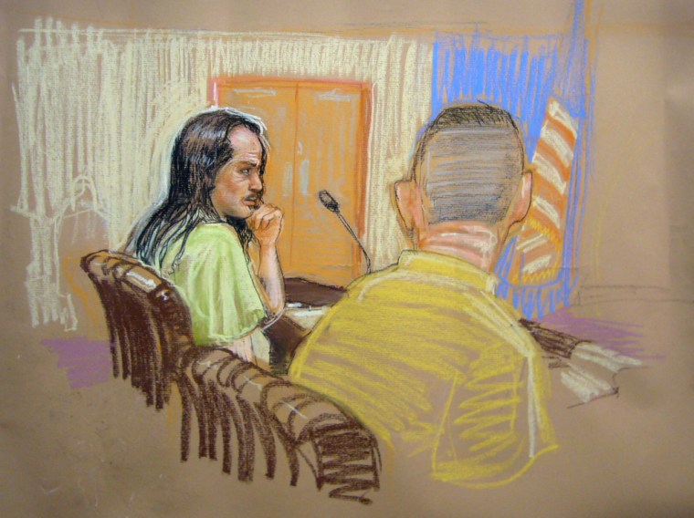 Detainee David Hicks, left, sits with his defense council in the U.S. military courtroom in Guantanamo Bay, Cuba, in this sketch from Monday.