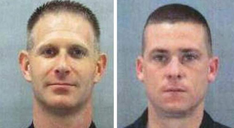 Officers Sean Clark, 34, left, and  Jeffrey Shelton, 35, were shot and killed in the line of duty late Saturday after answering a disturbance call in Charlotte, N.C.