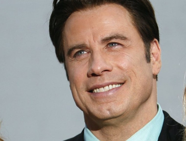 John Travolta poses with Kelly Preston and Michelle Pfeiffer at the premiere of Hairspray at the Mann Village theatre in Westwood