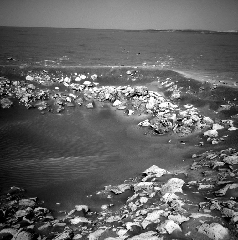 The Opportunity rover's navigation camera provides a view of the jumbled bedrock lining the rim of Fram Crater in Mars' Meridiani Planum.