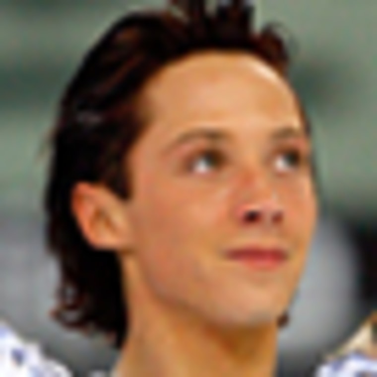 Johnny Weir, of the United States, waves after his Men's Figure Skating short program at the Turin 2006 Winter Olympic Games in Turin, Italy, Tuesday, Feb. 14, 2006.  (AP Photo/Kevork Djansezian)