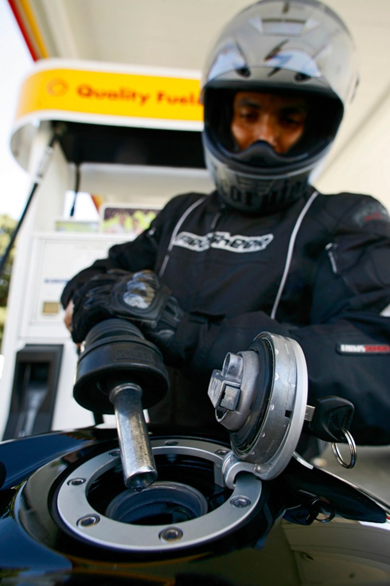 Image: Oscar Gonzales fuels a motorcyle he bought to save on gas