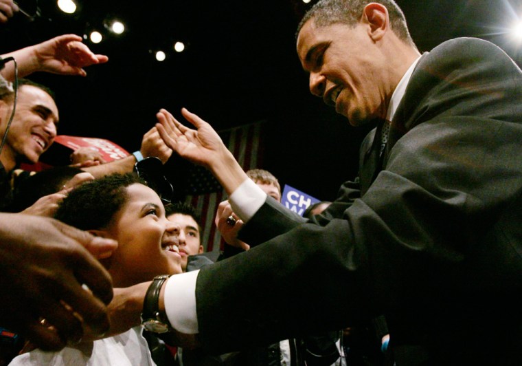 Image: Democratic Presidential candidate Obama greets a young supporter in Columbia