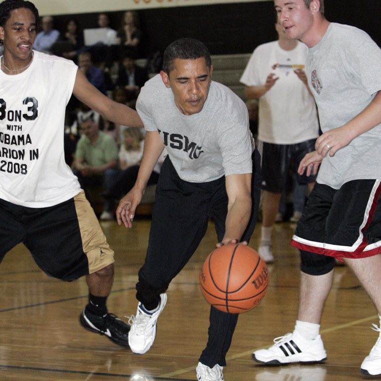 Obama plays basketball during a campaign stop in Kokomo