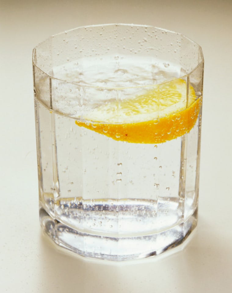 Mineral water with lemon wedge