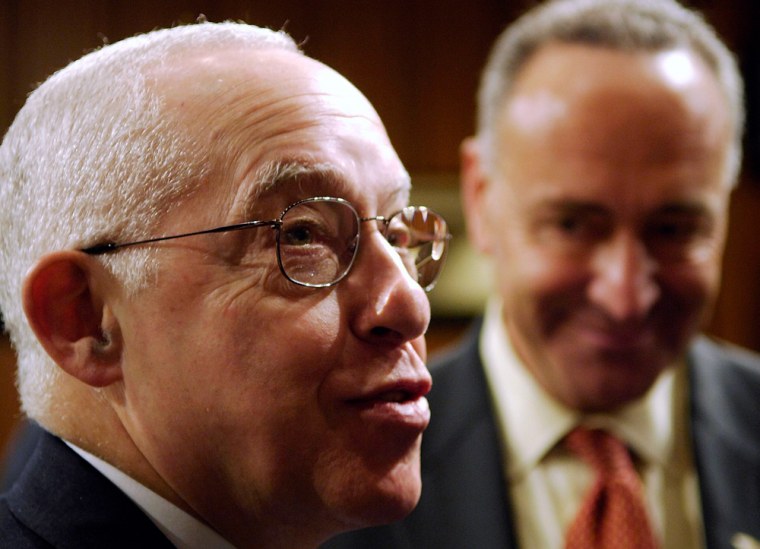 Nominee for U.S. Attorney General Mukasey stands with Sen. Schumer during a break in Mukasey's confirmation hearing in Washington