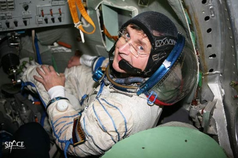 International Space Station-bound space tourist Charles Simonyi trains inside a Soyuz spacecraft simnulator while wearing a Sokol spacesuit. He is due to launch towards the ISS on April 7, 2007. Credit: Space Adventures.