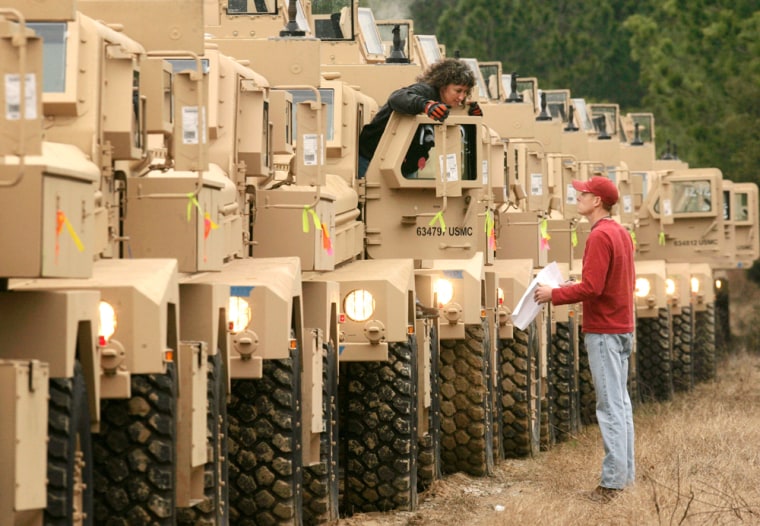 Workers at the Naval Weapon Station, in Charleston, S.C., prepare Mine Resistant Ambush Protected vehicles, or MRAPs, in January for departure to Iraq and Afghanistan.