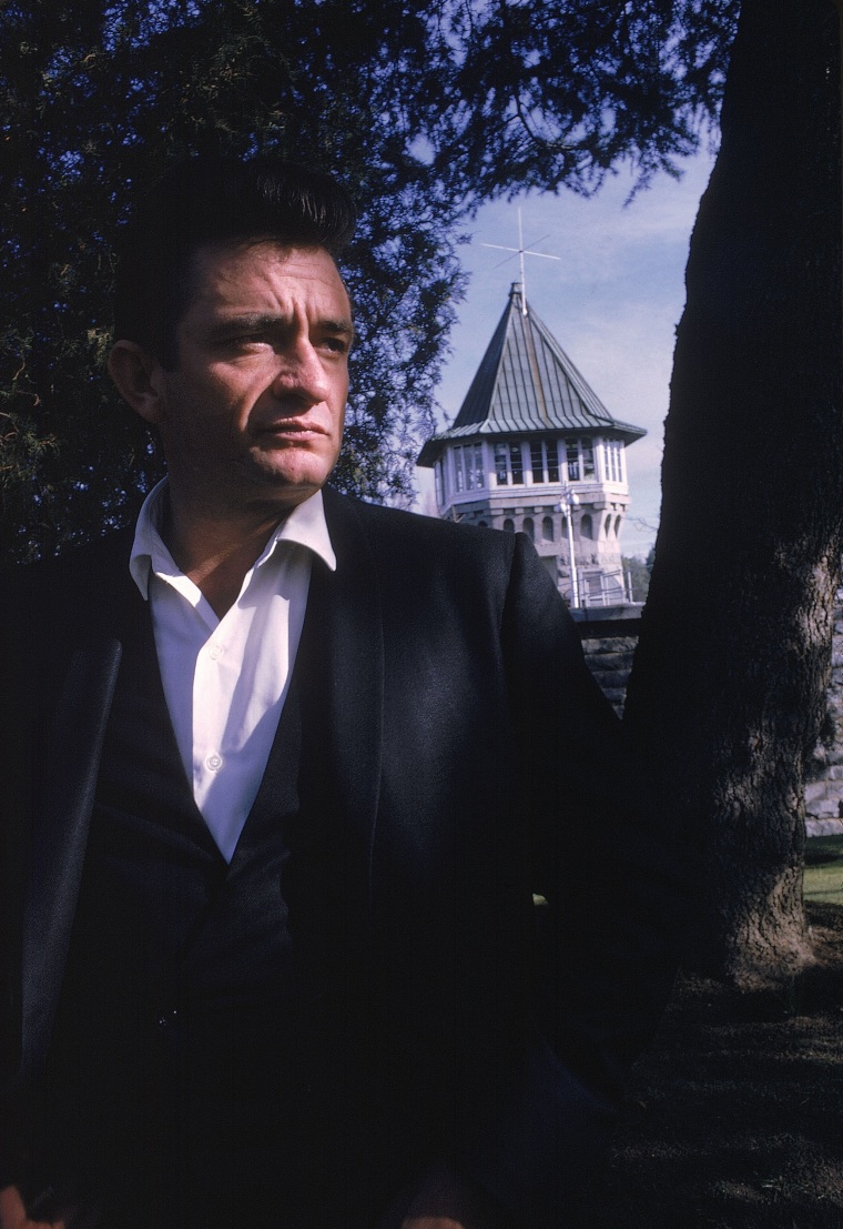 **FILE** Country singer Johnny Cash poses outside the Folsom Prison in California in this January 13, 1968 file photo, the day he recorded his live album \"Johnny Cash at Folsom Prison.\"   Producers of an upcoming movie on the life of country music singer Johnny Cash say they may start shooting in June 2004. (AP Photo/Dan Poush, File)