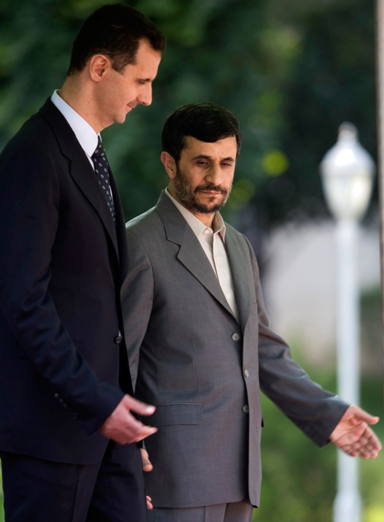 Iranian President Mahmoud Ahmadinejad welcomes his Syrian counterpart Bashar al-Assad in Tehran