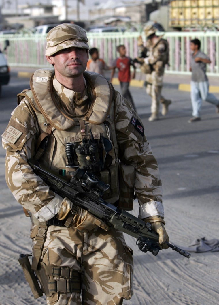 Image: A British soldier patrols a road in Garma, Iraq