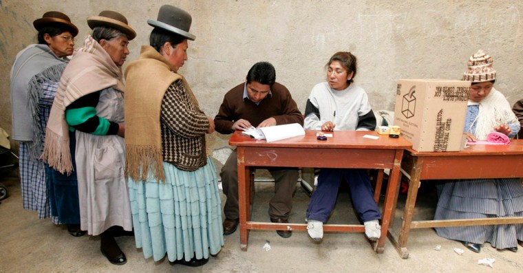 Aymara women queue to cast their ballot